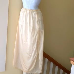 Vintage long half slip. Unknown brand.  Size small. Elastic is intact.